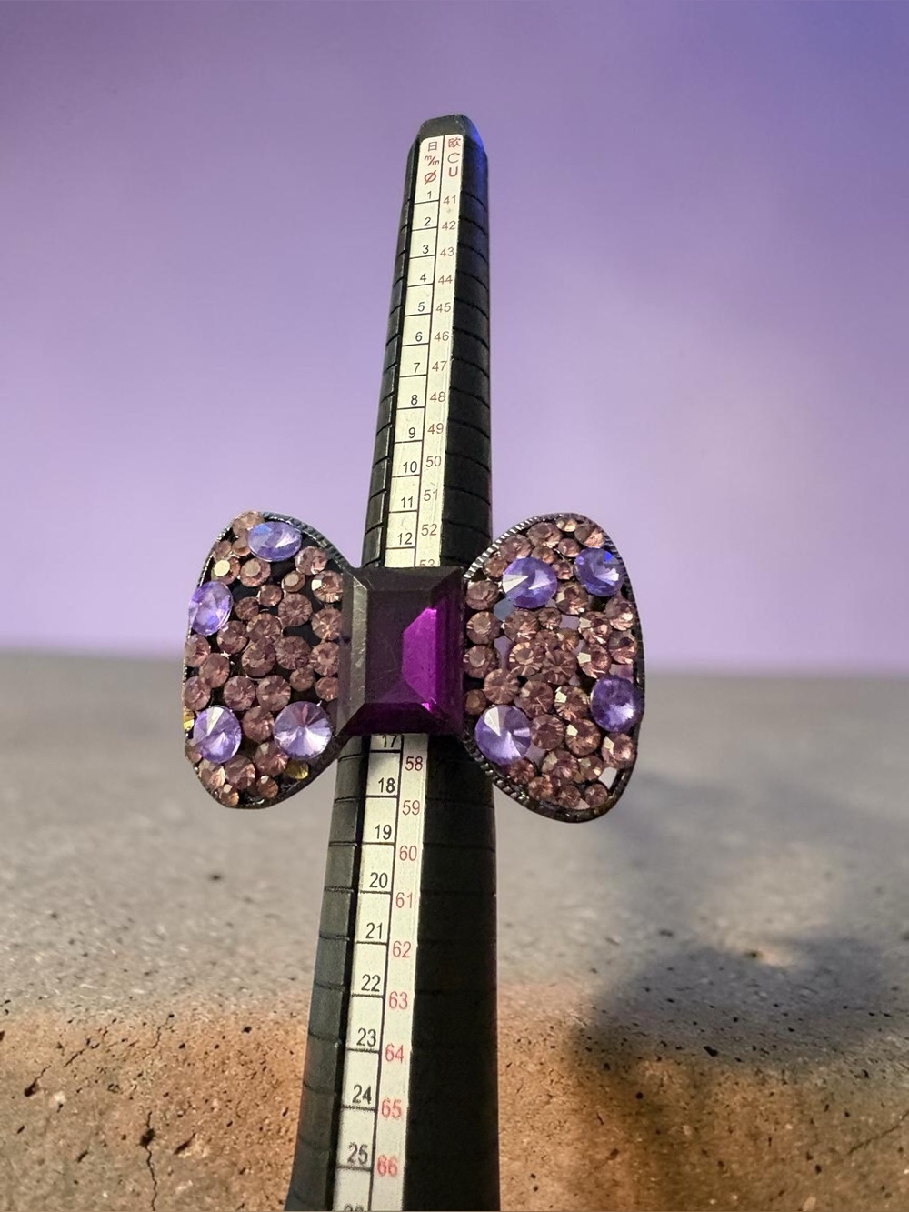 Y2K Purple Rhinestone Bow Statement Ring Adjustable sitting at size 7 1/2